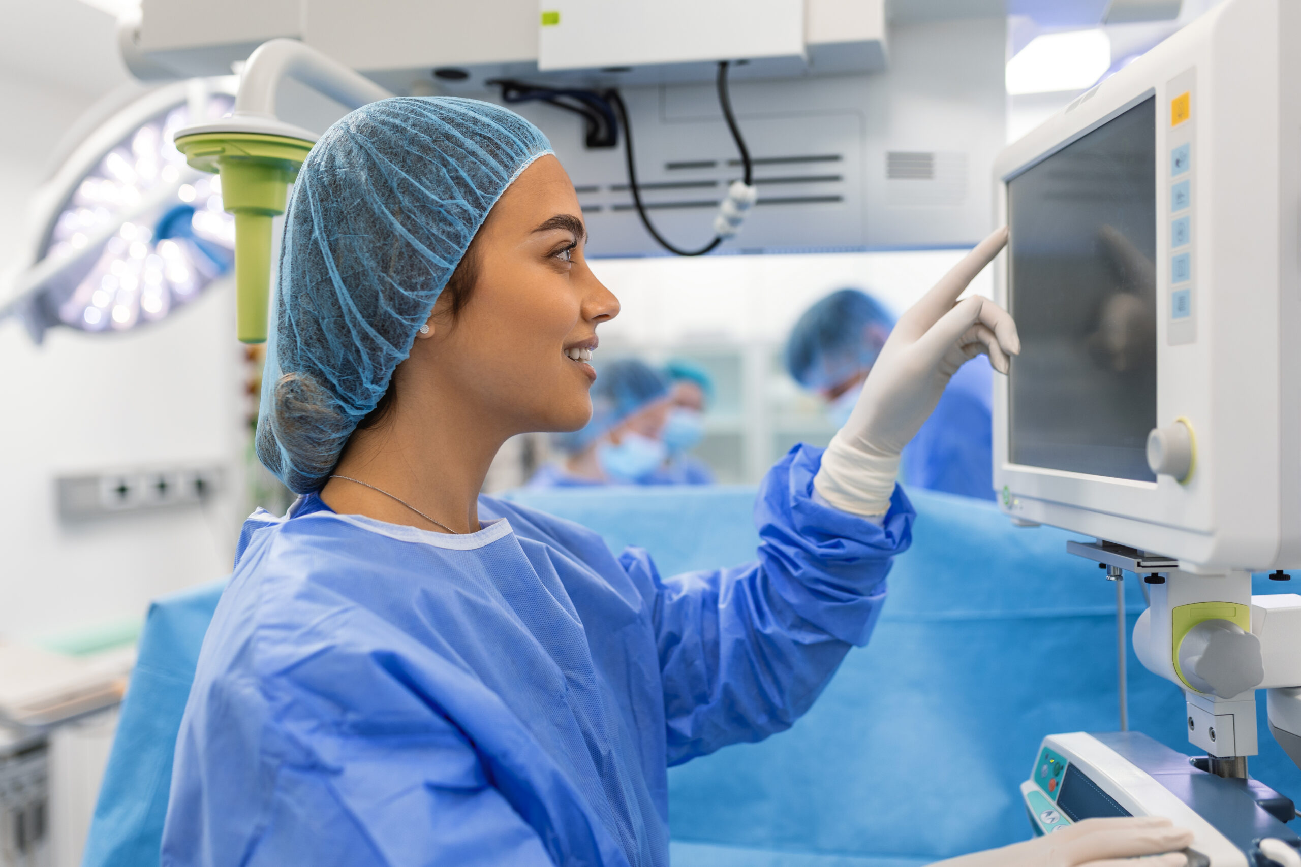 anesthesiologist keeping track vital functions body cardiac surgery surgeon looking medical monitor surgery doctor checking monitor patient health status